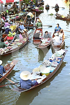 AMPHAWA Ã¢â¬â APRIL 29: Wooden boats are loaded with fruits from the orchards at Tha kha floating market